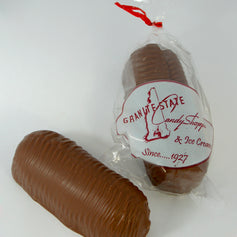 Milk chocolate dipped Twinkie novelty treat